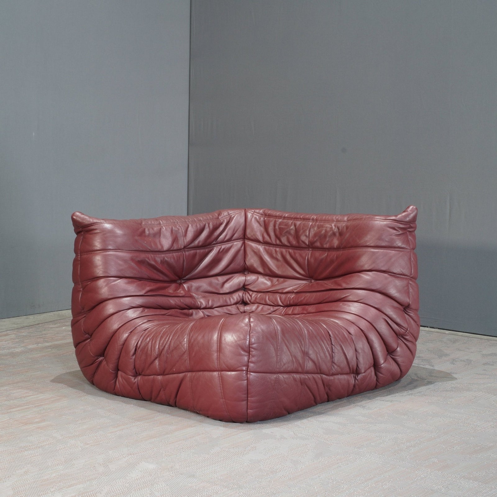 Ligne Roset Burgundy Leather Modular Sofas and Footstool, by Michel Ducaroy, Set of Six @ REHAUS