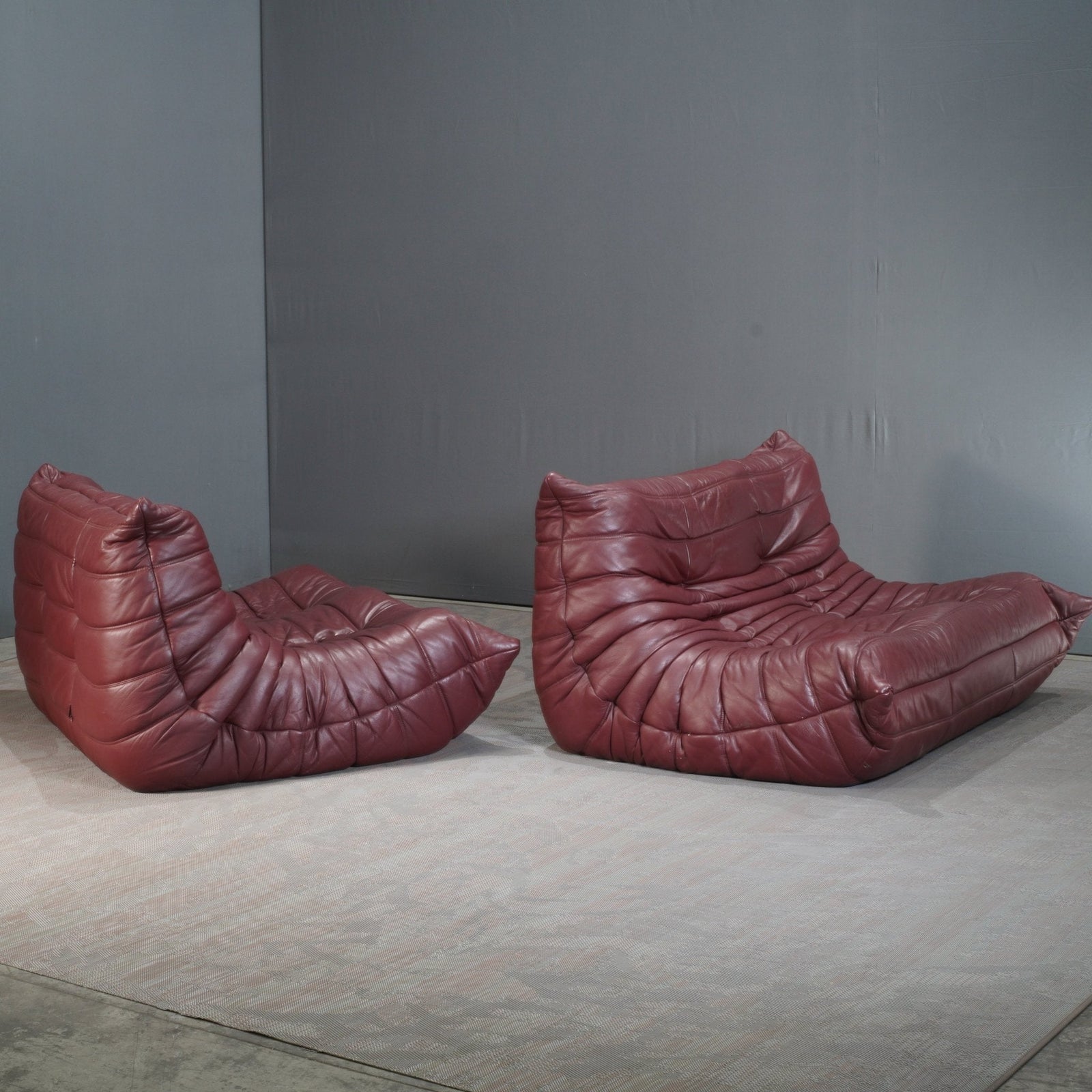 Ligne Roset Burgundy Leather Modular Sofas and Footstool, by Michel Ducaroy, Set of Six @ REHAUS