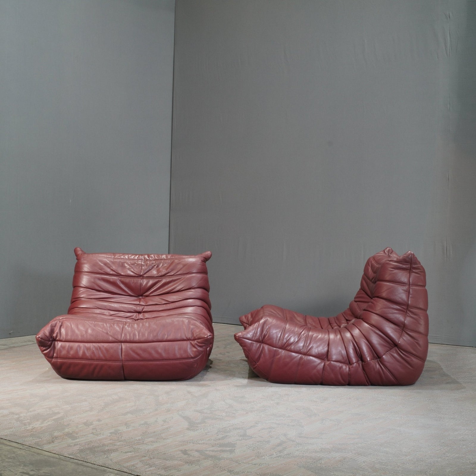 Ligne Roset Burgundy Leather Modular Sofas and Footstool, by Michel Ducaroy, Set of Six @ REHAUS