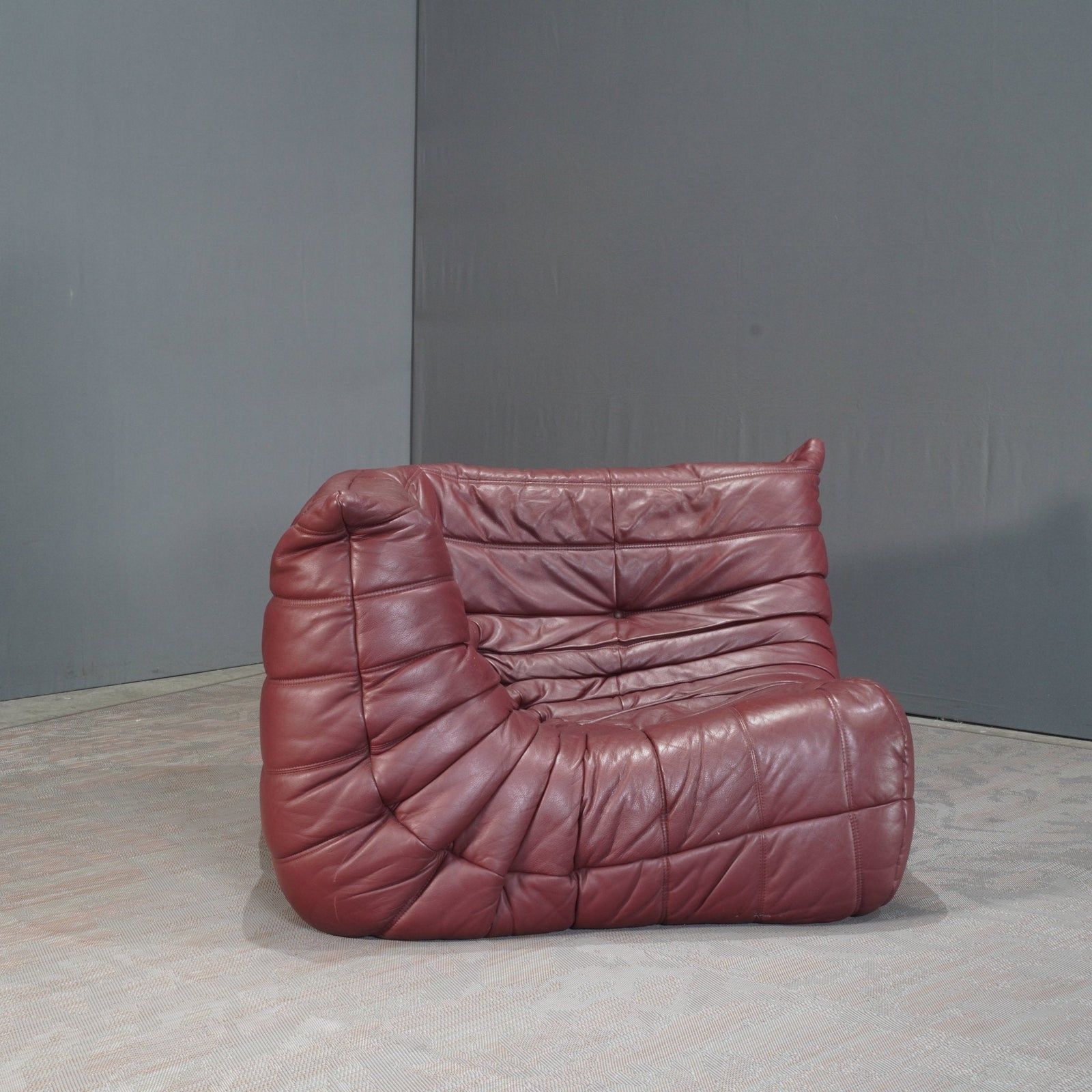 Ligne Roset Burgundy Leather Modular Sofas and Footstool, by Michel Ducaroy, Set of Six @ REHAUS